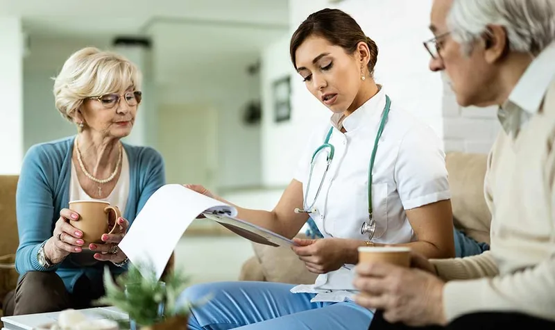 Caregiver with elderly parent at a doctor appointment