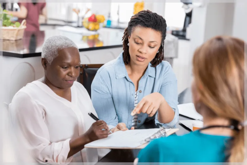 Caregiver helping a senior with paperwork and benefits applications